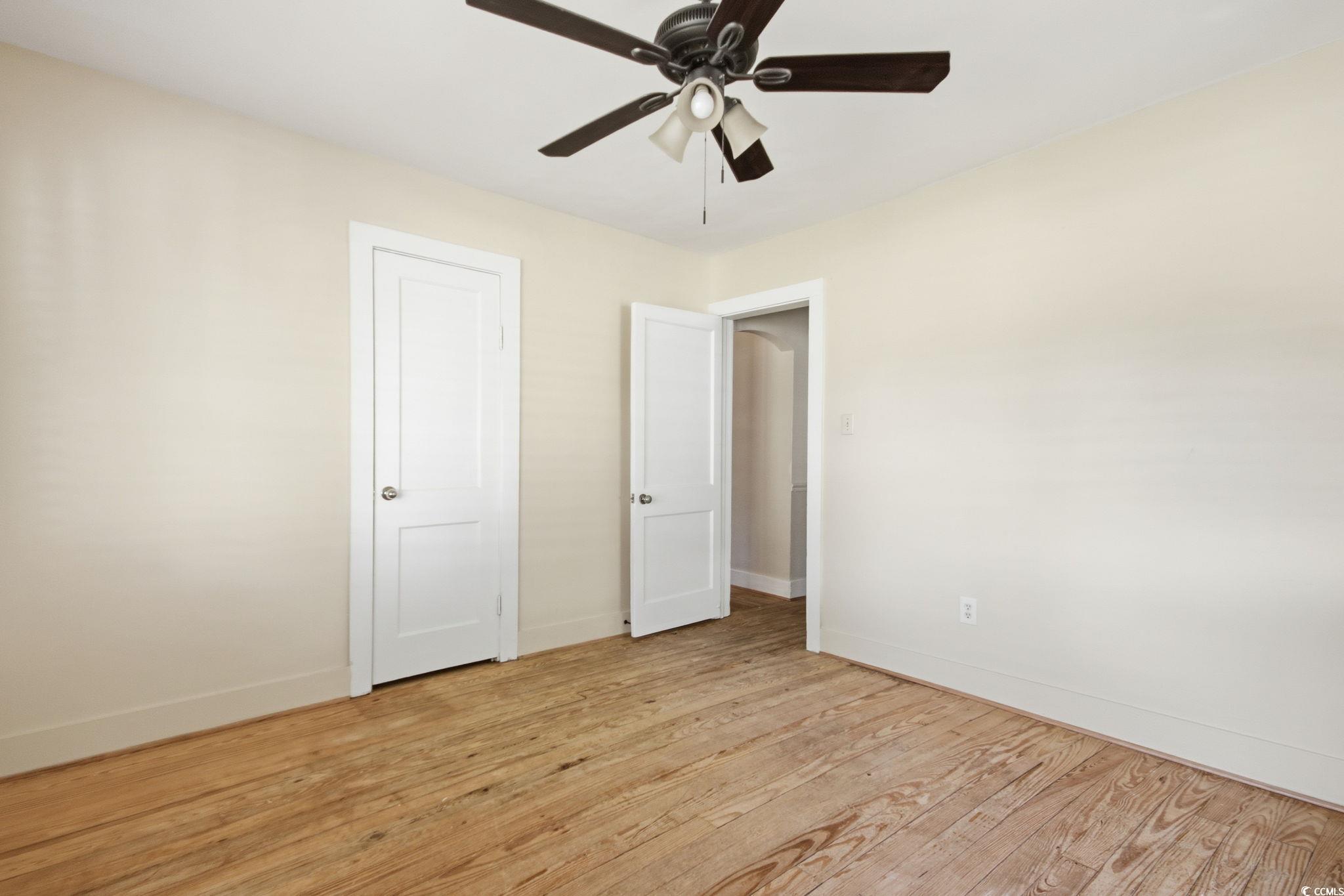 2206 Beck Street Georgetown, SC 29440 - Photo 28 of 36 Unfurnished bedroom featuring light wood-style floors and ceiling fan