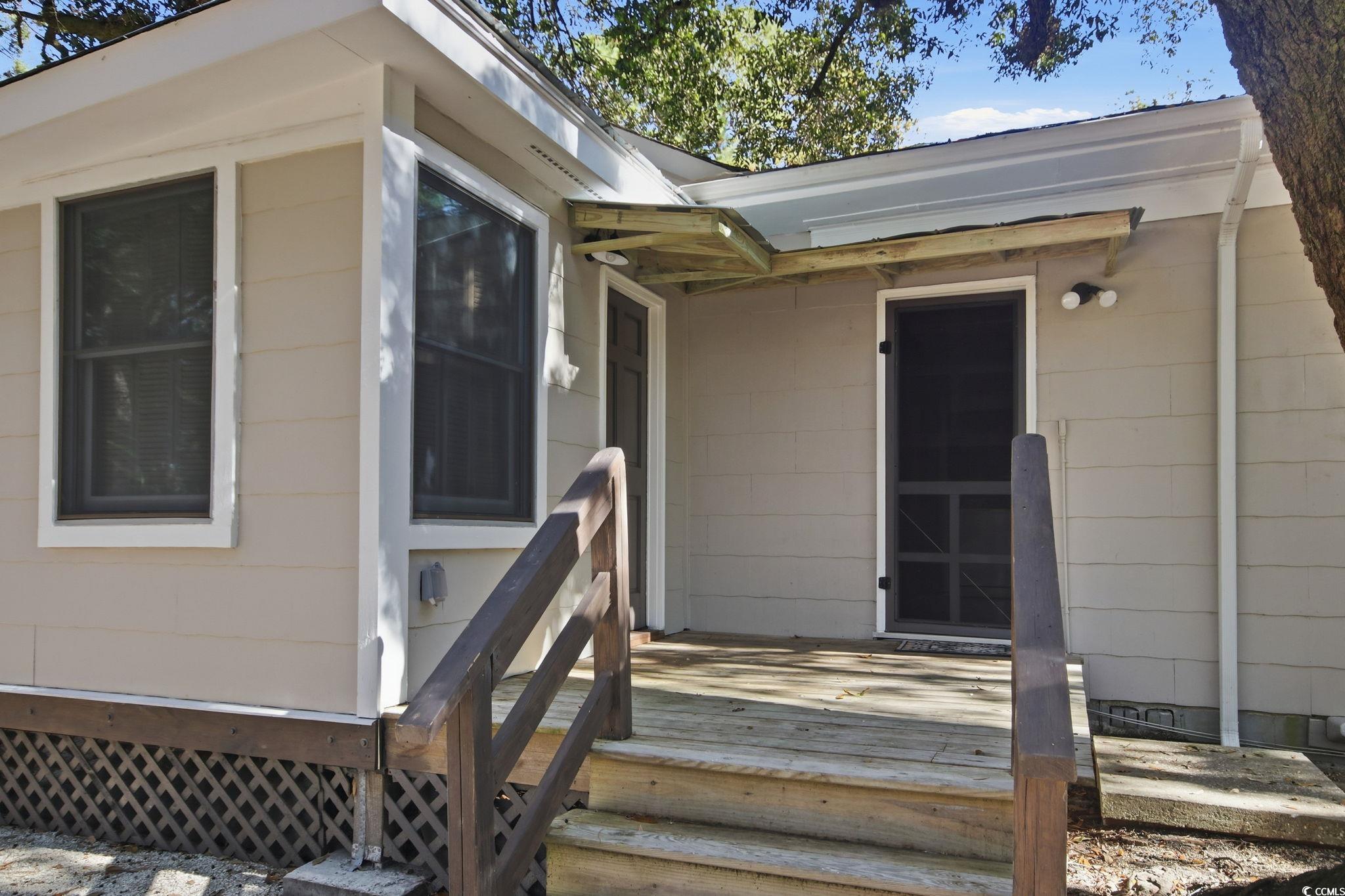 2206 Beck Street Georgetown, SC 29440 - Photo 32 of 36 Doorway to property with a wooden deck