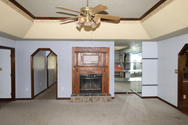 207 J R Boulevard Macon, GA 31220 - Photo 3 of 18 a view of empty room with a fireplace and cabinet