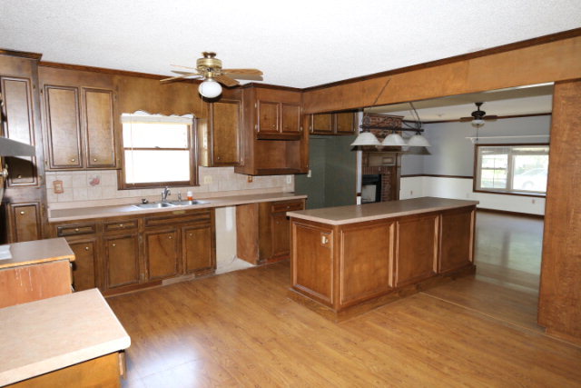 207 J R Boulevard Macon, GA 31220 - Photo 4 of 18 a kitchen with stainless steel appliances granite countertop a sink a stove and a refrigerator