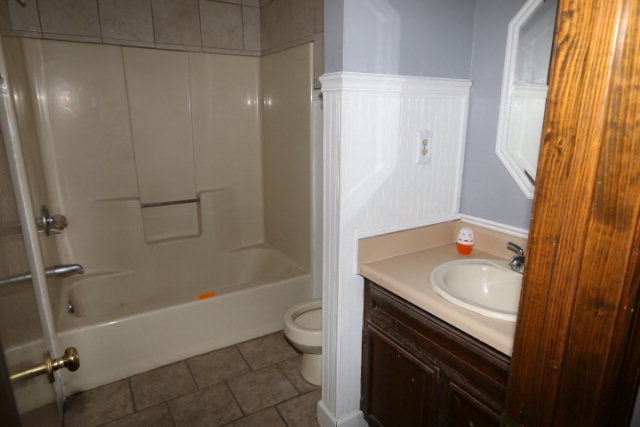 207 J R Boulevard Macon, GA 31220 - Photo 8 of 18 a bathroom with a sink a toilet and shower