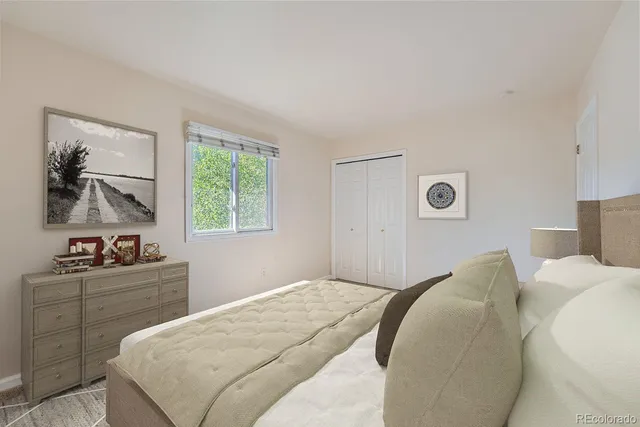 a bedroom with a bed and a closet