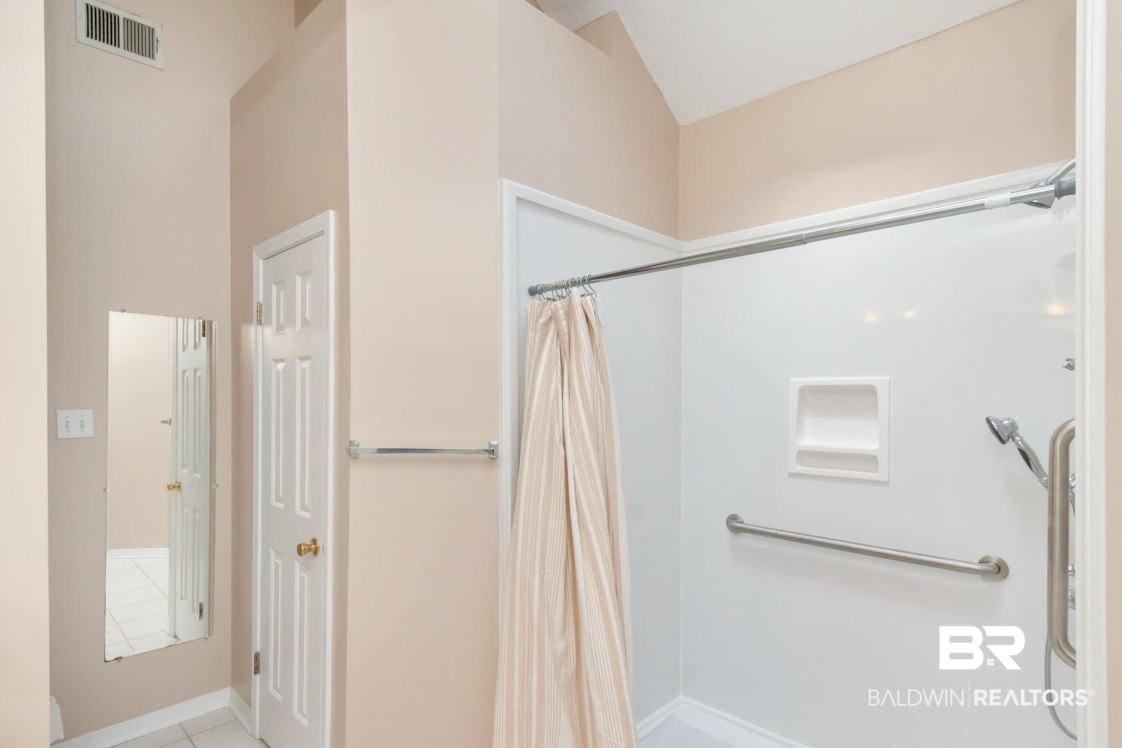 6117 Lennox Place Mobile, AL 36693 - Photo 29 of 39 Bathroom with visible vents, tile patterned flooring, vaulted ceiling, baseboards, and a shower with shower curtain
