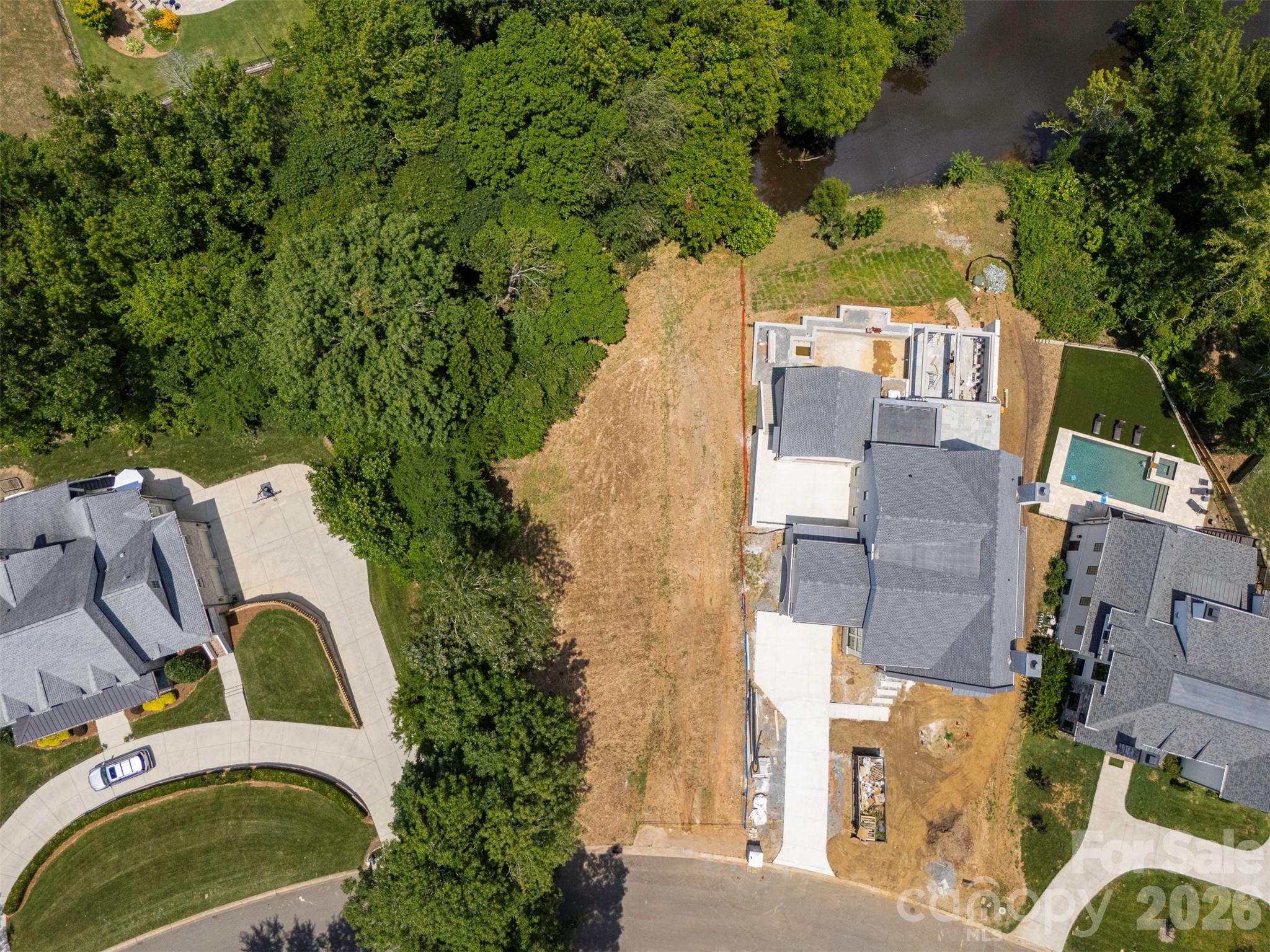 6538 Sharon Hills Road Charlotte, NC 28210 - Photo 2 of 2 an aerial view of a house with a yard and trees