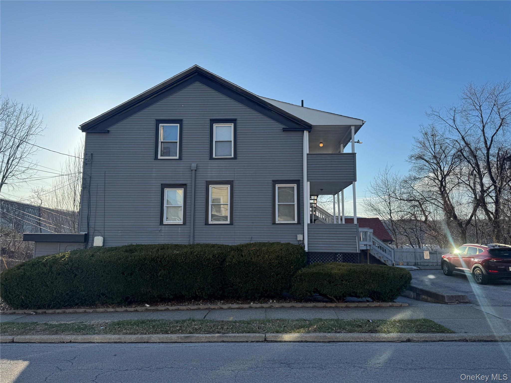 34 Hoffman Street Poughkeepsie, NY 12601 - Photo 2 of 10 a view of a house with a yard