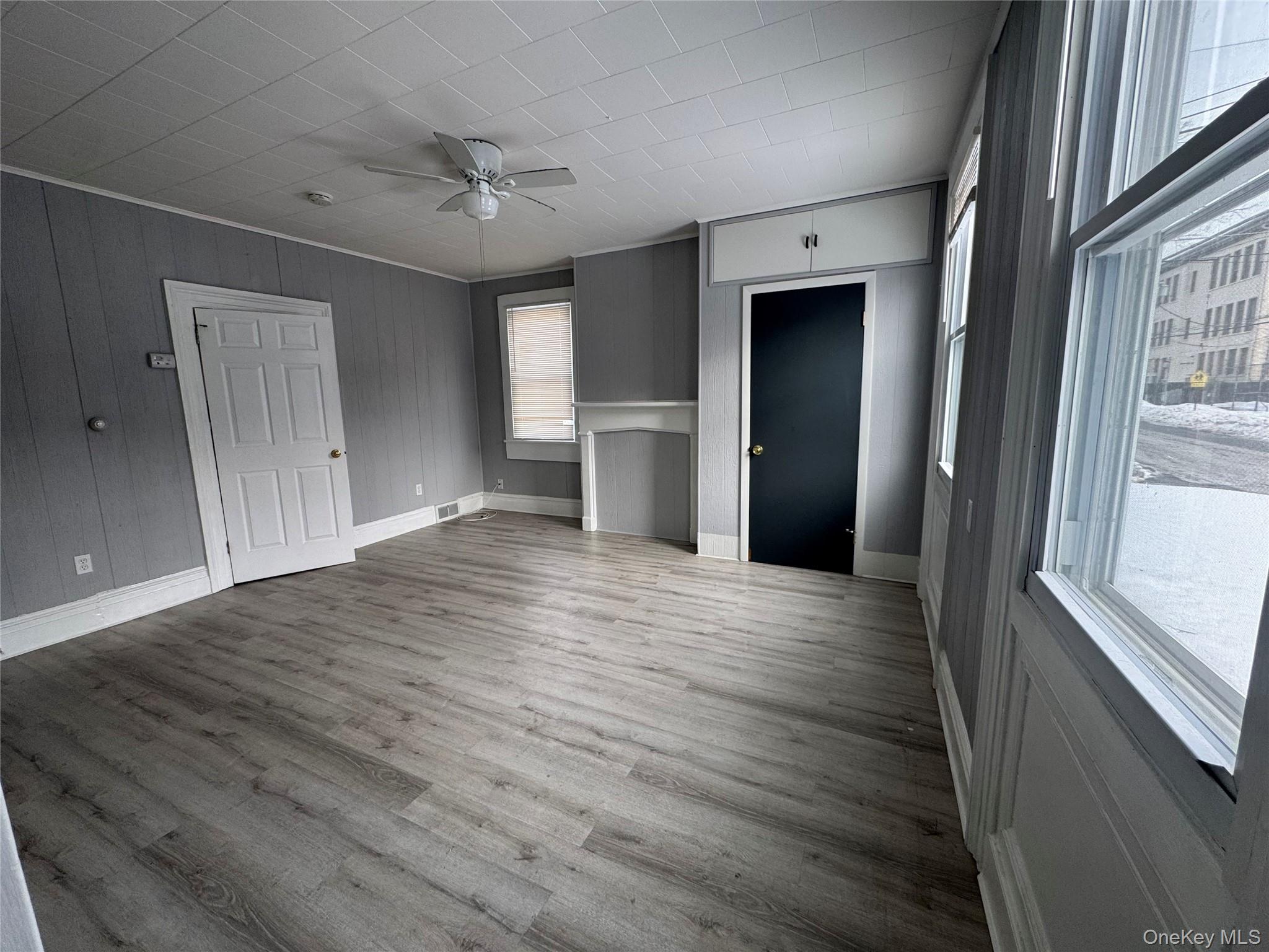 34 Hoffman Street Poughkeepsie, NY 12601 - Photo 4 of 10 a view of empty room with wooden floor