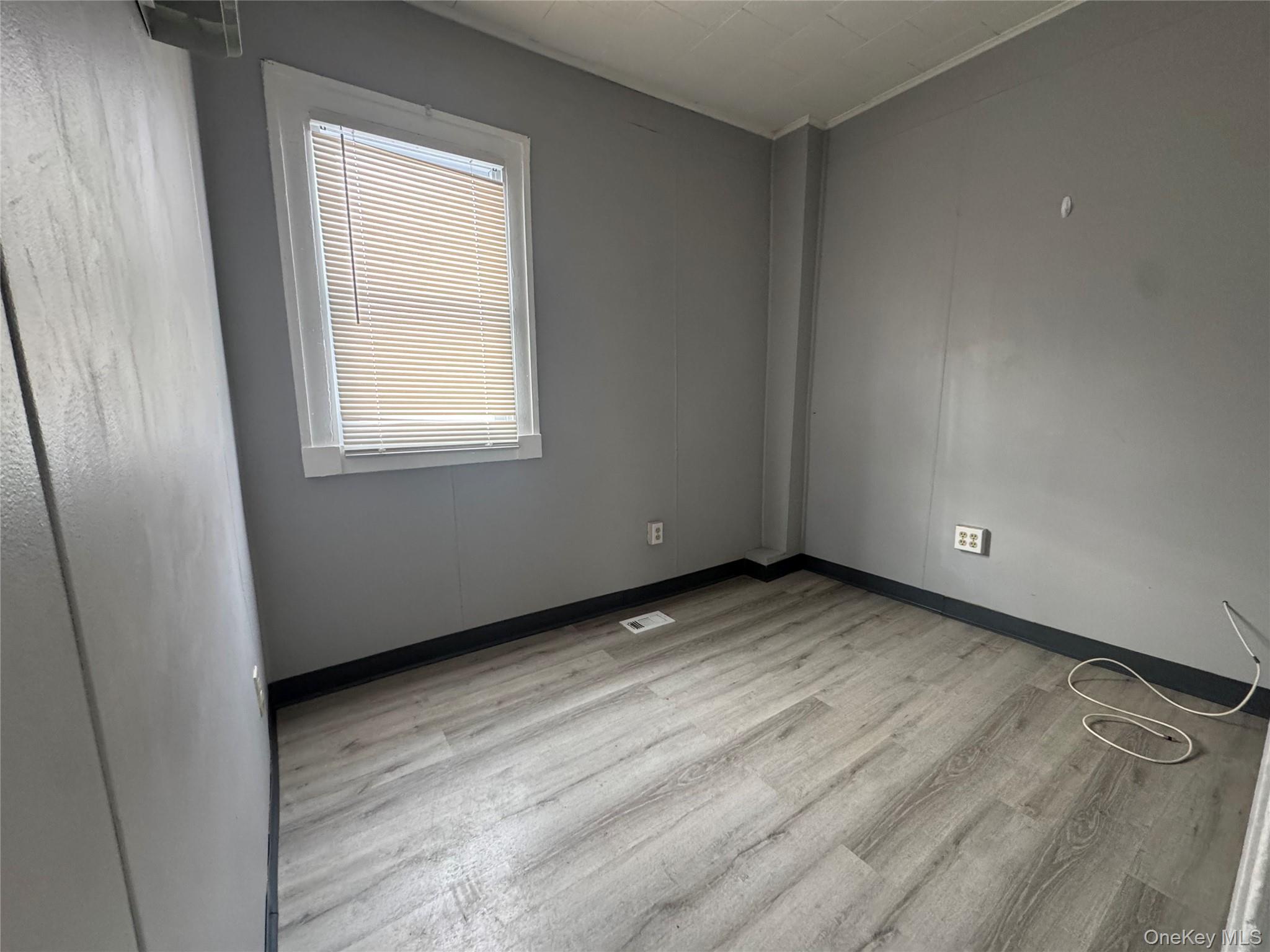 34 Hoffman Street Poughkeepsie, NY 12601 - Photo 5 of 10 an empty room with a window