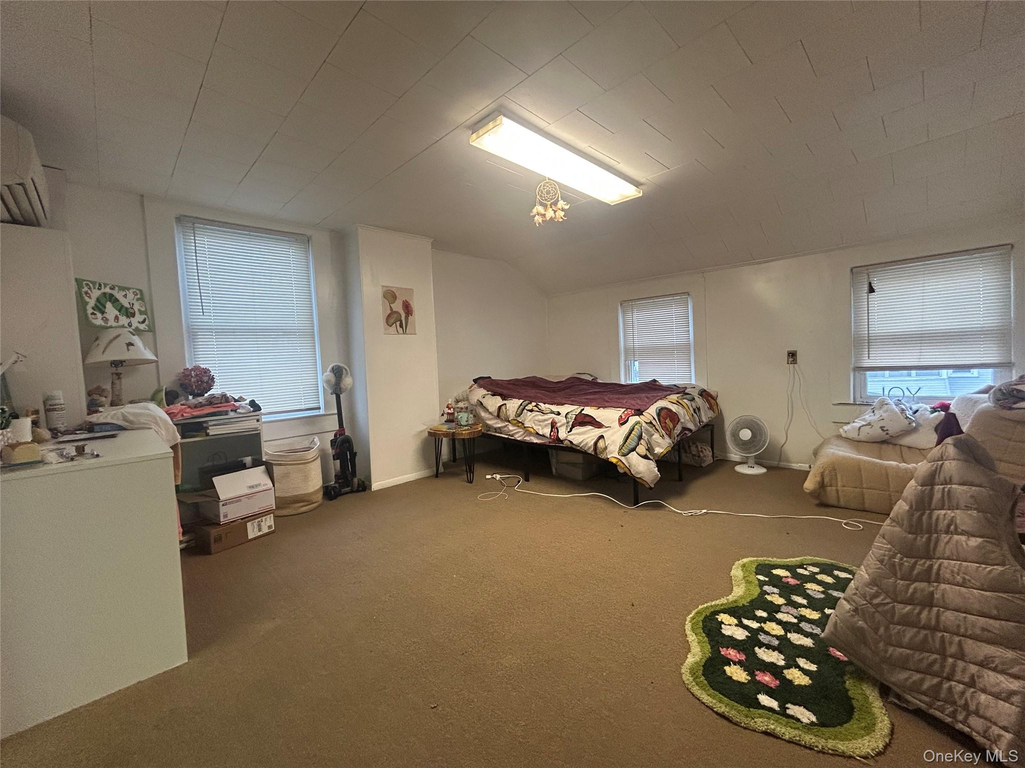 34 Hoffman Street Poughkeepsie, NY 12601 - Photo 7 of 10 a bed room with a bed and a couch