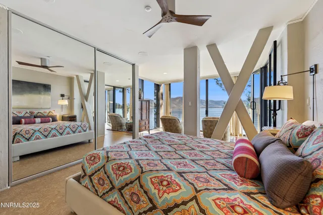 a bedroom with a bed and a mirror