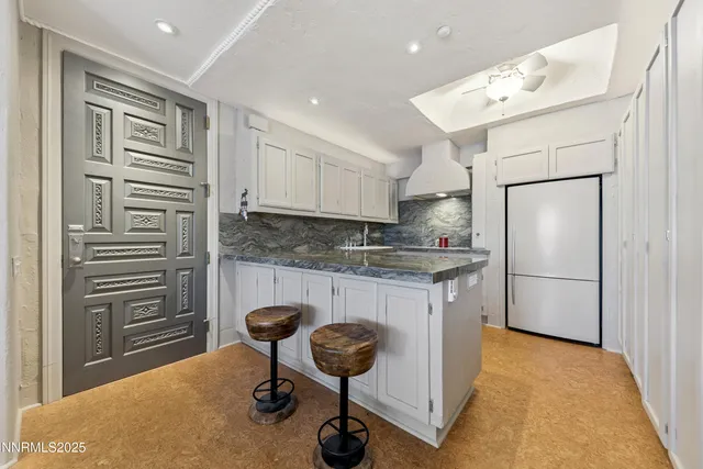 a kitchen that has a sink and cabinets in it