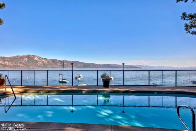 a view of a garden with lawn chairs