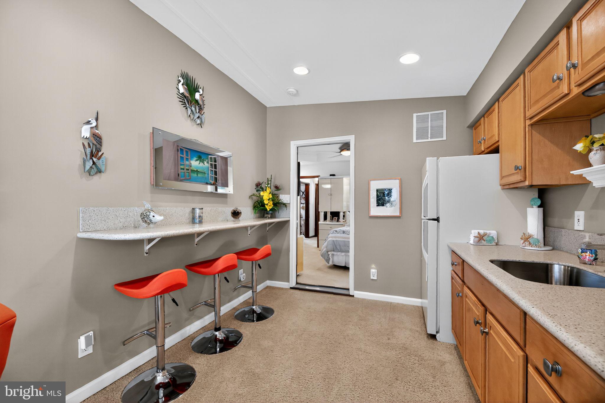 37 Pine Grove Avenue Clementon, NJ 08021 - Photo 12 of 28 a kitchen with stainless steel appliances kitchen island granite countertop a sink a stove and a refrigerator