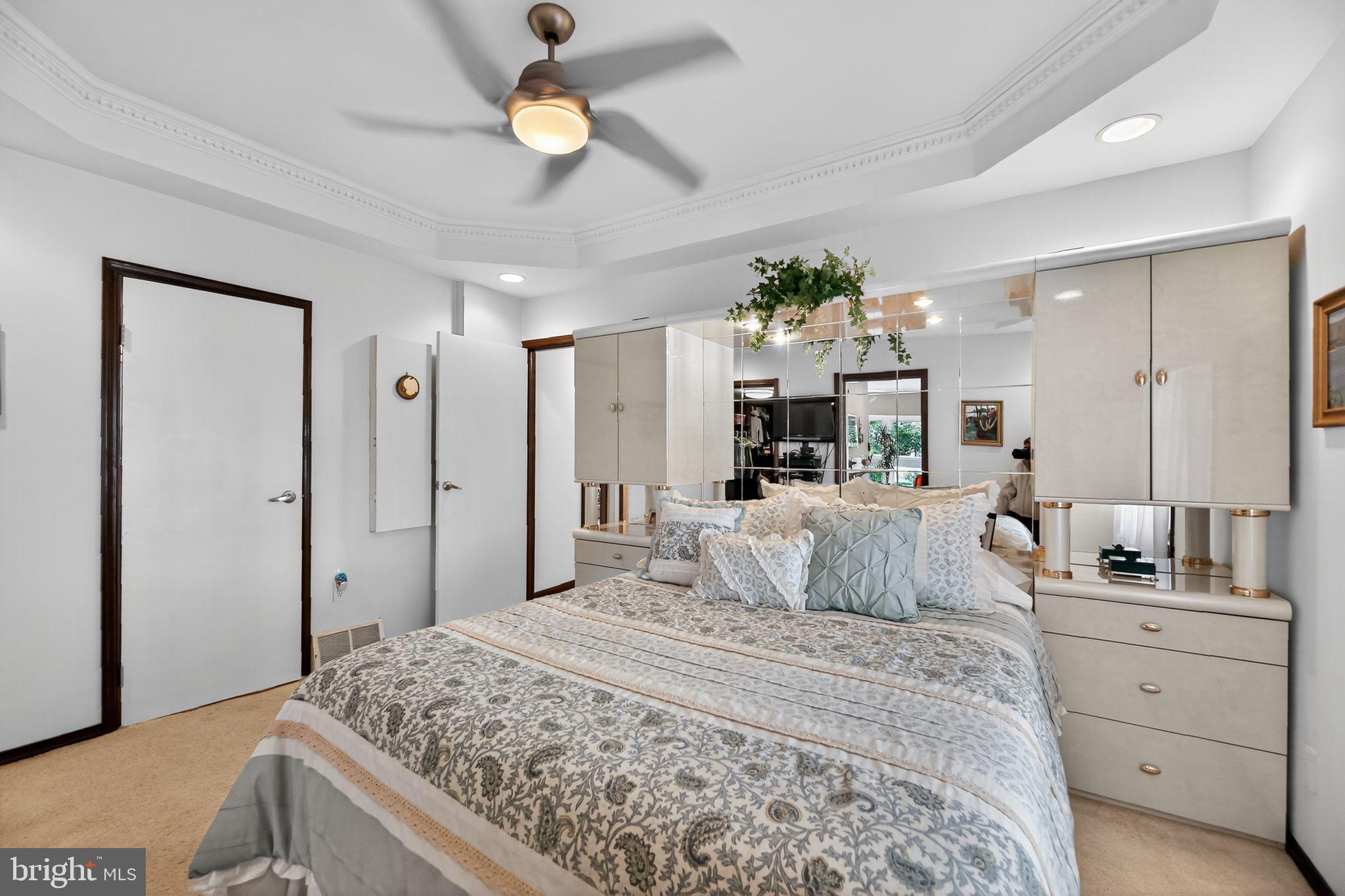 37 Pine Grove Avenue Clementon, NJ 08021 - Photo 15 of 28 a bedroom with a bed and a chandelier