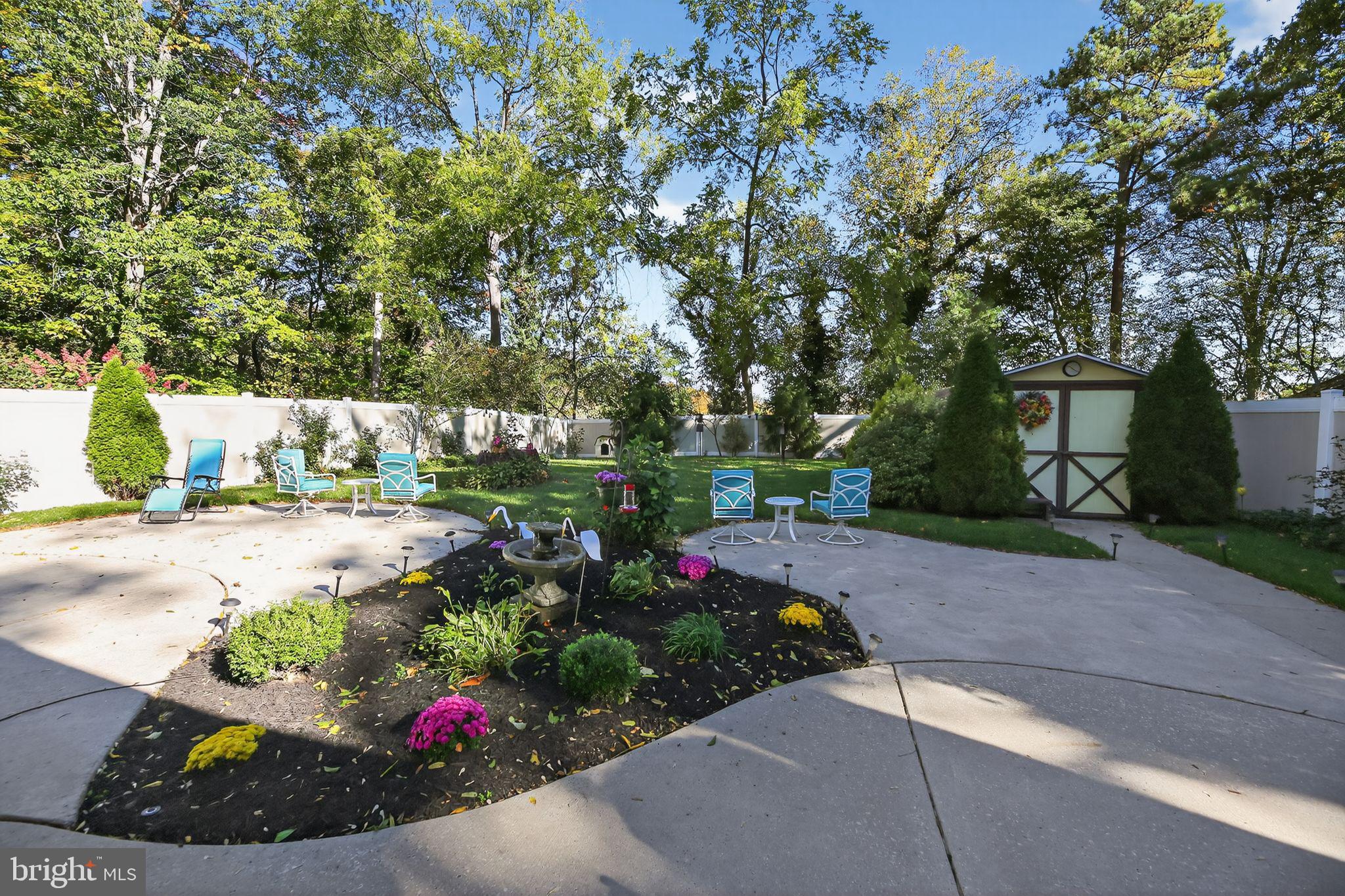 37 Pine Grove Avenue Clementon, NJ 08021 - Photo 24 of 28 a view of a garden with flowers and trees