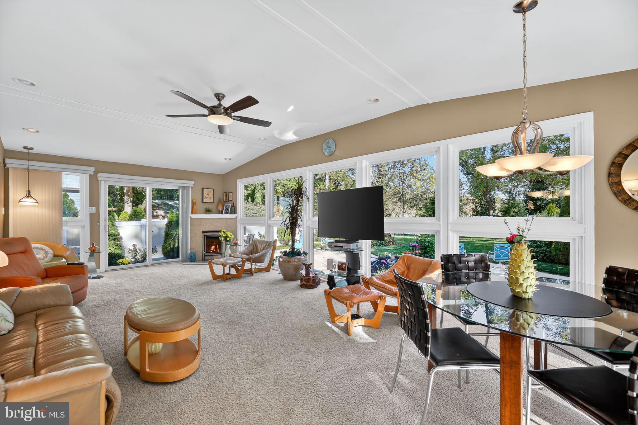 37 Pine Grove Avenue Clementon, NJ 08021 - Photo 4 of 28 a living room with furniture a flat screen tv and floor to ceiling window