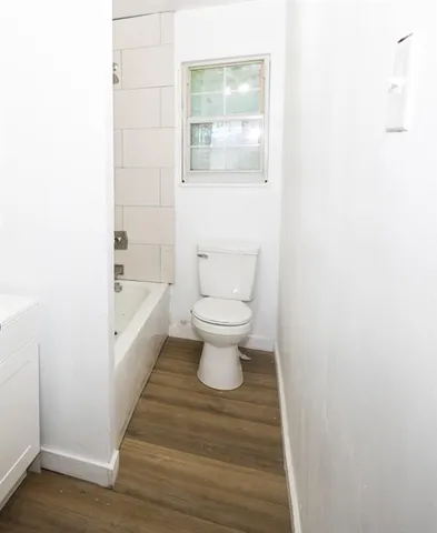 a bathroom with a toilet and a sink
