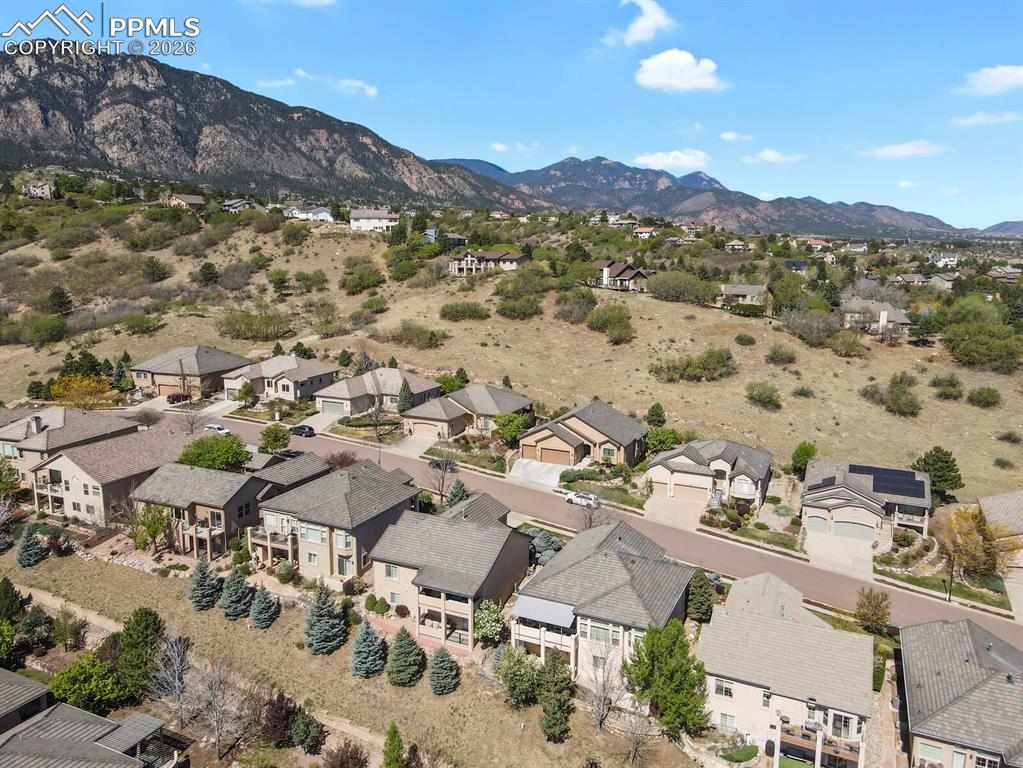 617 Concerto Drive Colorado Springs, CO 80906 - Photo 43 of 46 This aerial view features the property, third home from the bottom right of the photo set against a backdrop of mountainous terrain