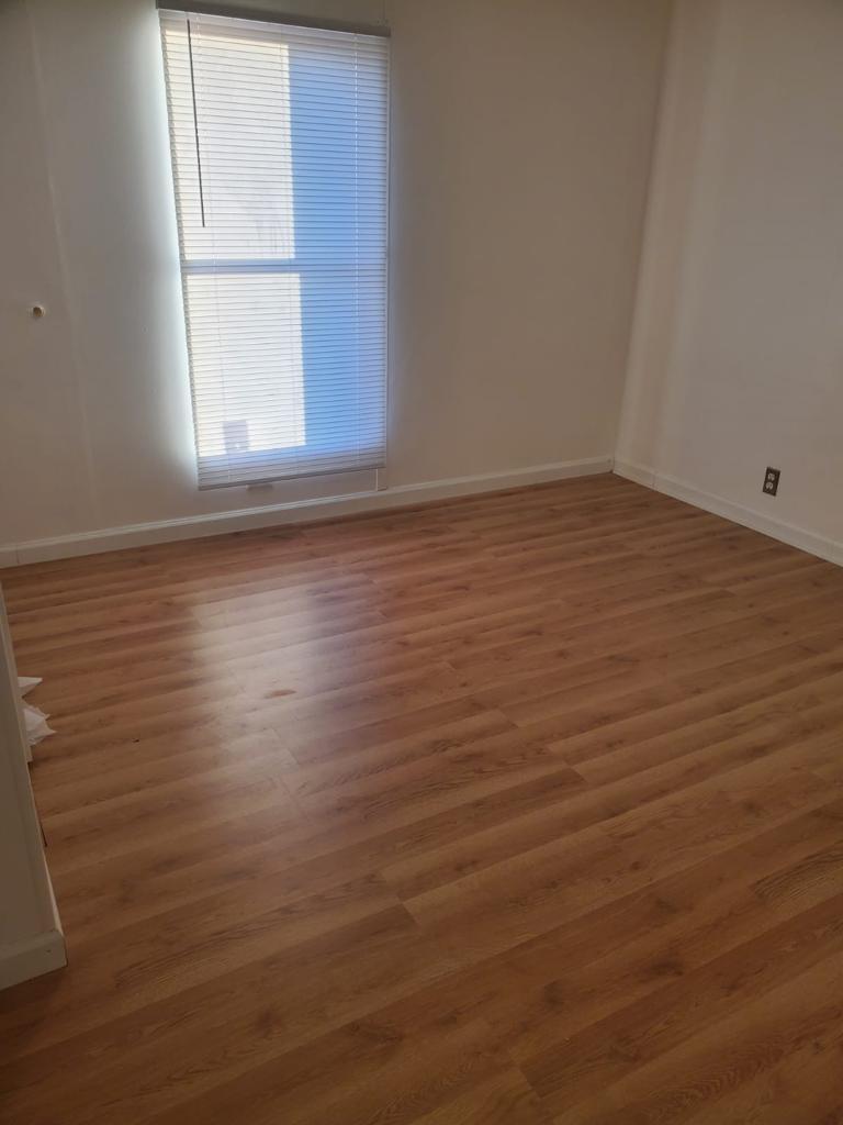 99 Partridge Lane Beecher, IL 60401 - Photo 19 of 22 an empty room with wooden floor and windows