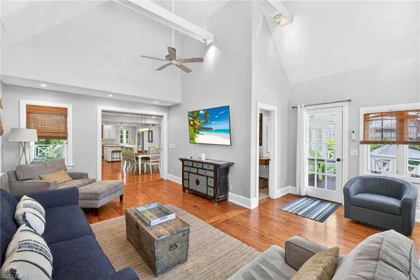 a living room with fireplace furniture and a flat screen tv
