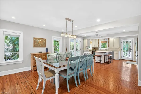 a view of a dining room with furniture window and wooden floor
