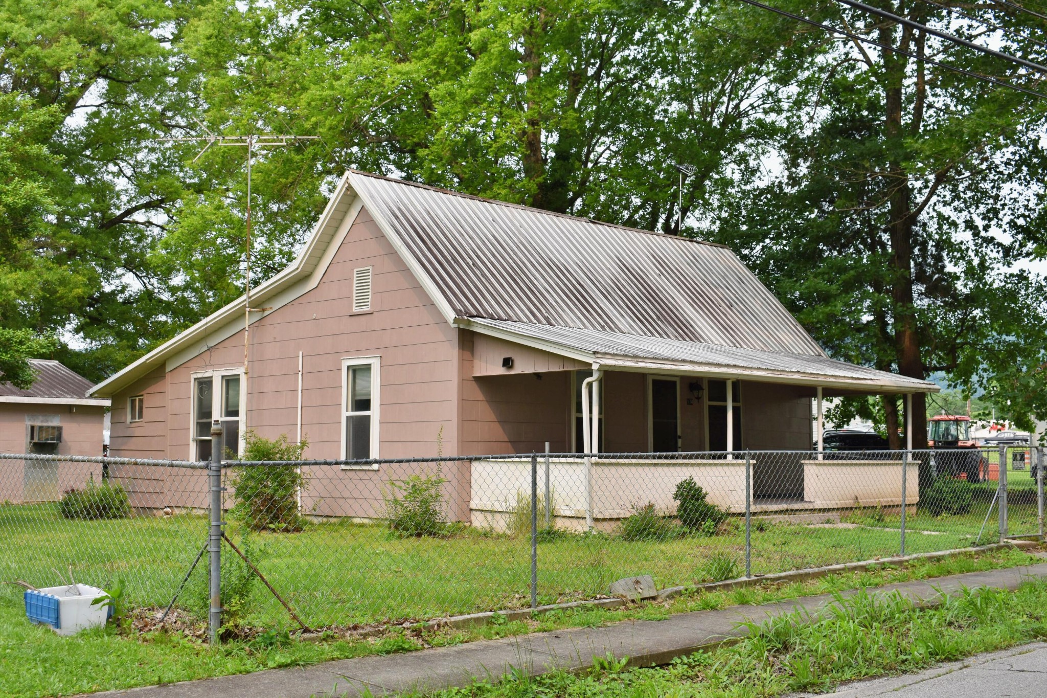 174 East Jackson Avenue Spring City, TN 37381 - Photo 1 of 28 a front view of a house with a yard