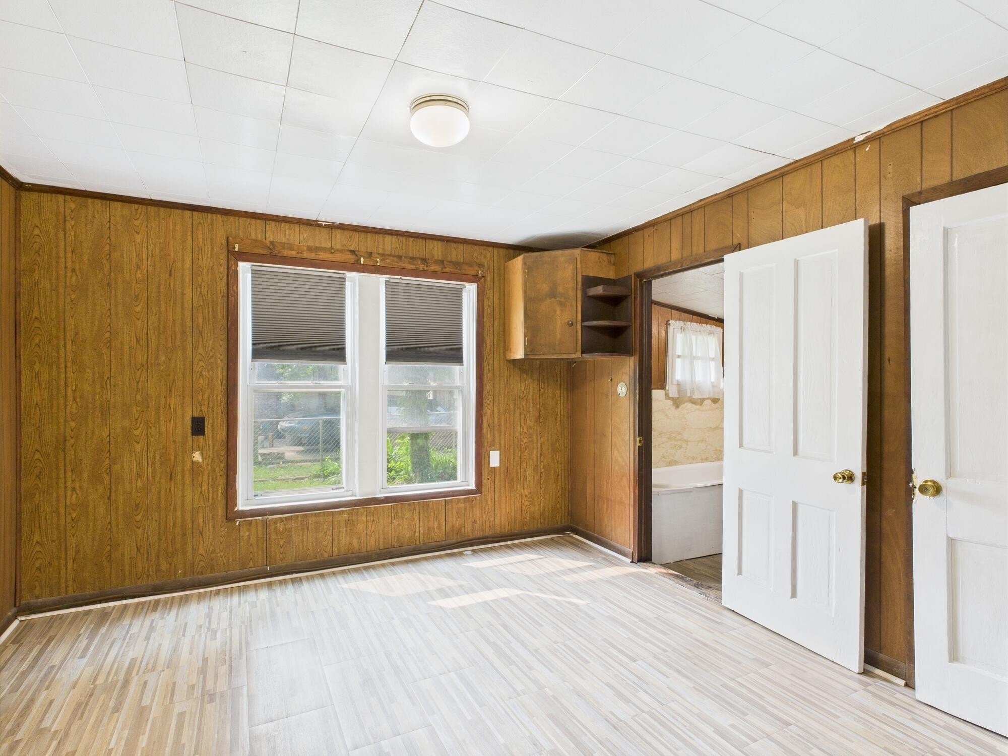 174 East Jackson Avenue Spring City, TN 37381 - Photo 14 of 28 an empty room with wooden floor and windows