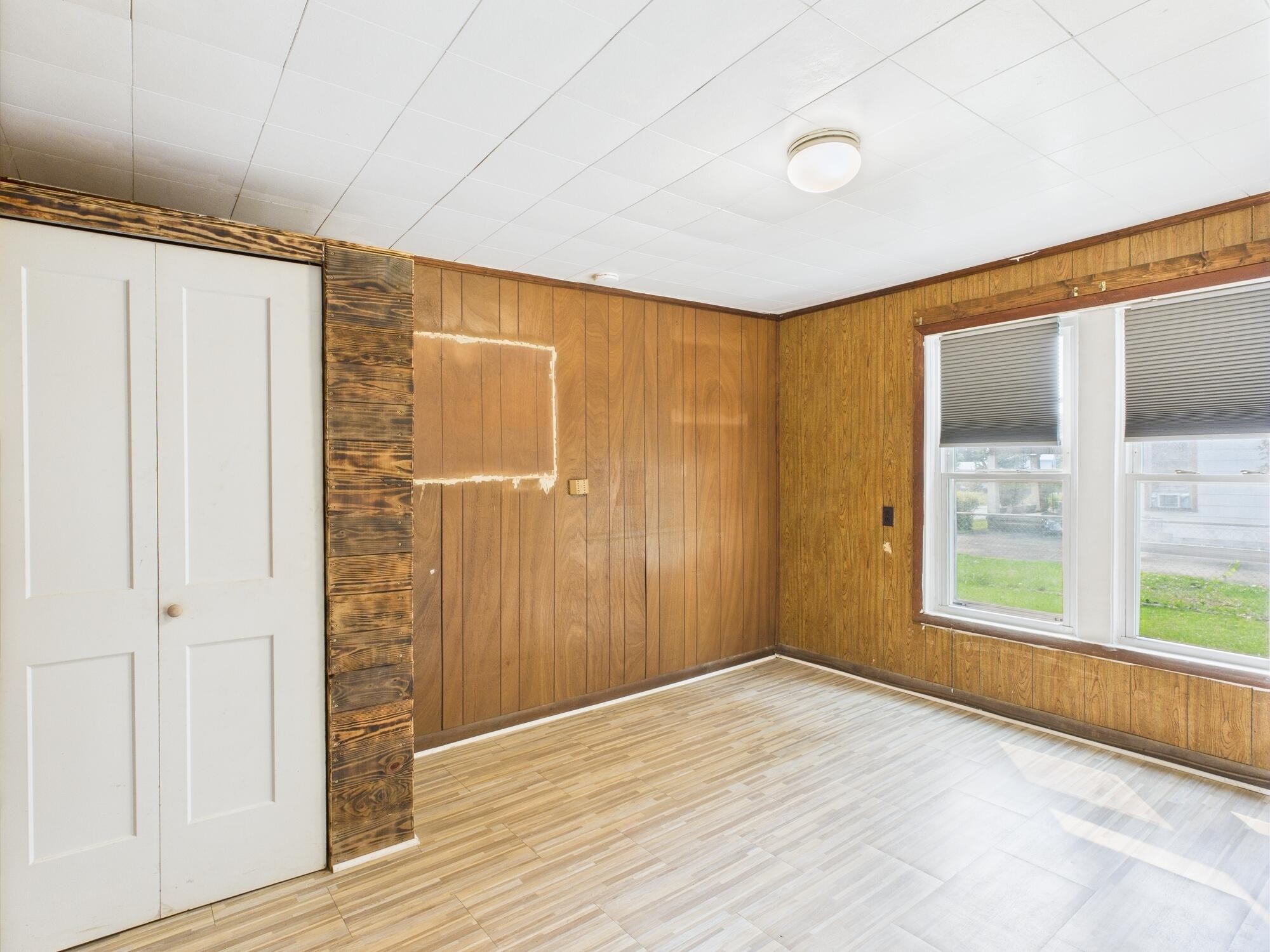 174 East Jackson Avenue Spring City, TN 37381 - Photo 15 of 28 a view of an empty room with wooden floor and a window