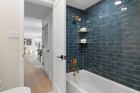 a bathroom with a bathtub and a shower