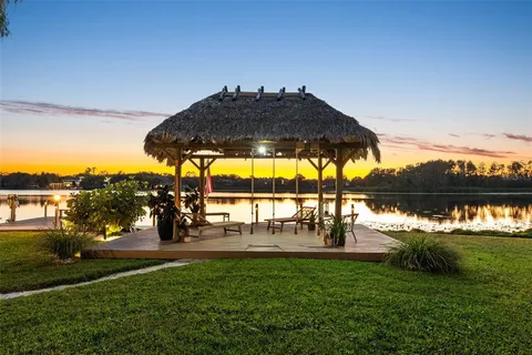 a view of outdoor space with lounge chairs