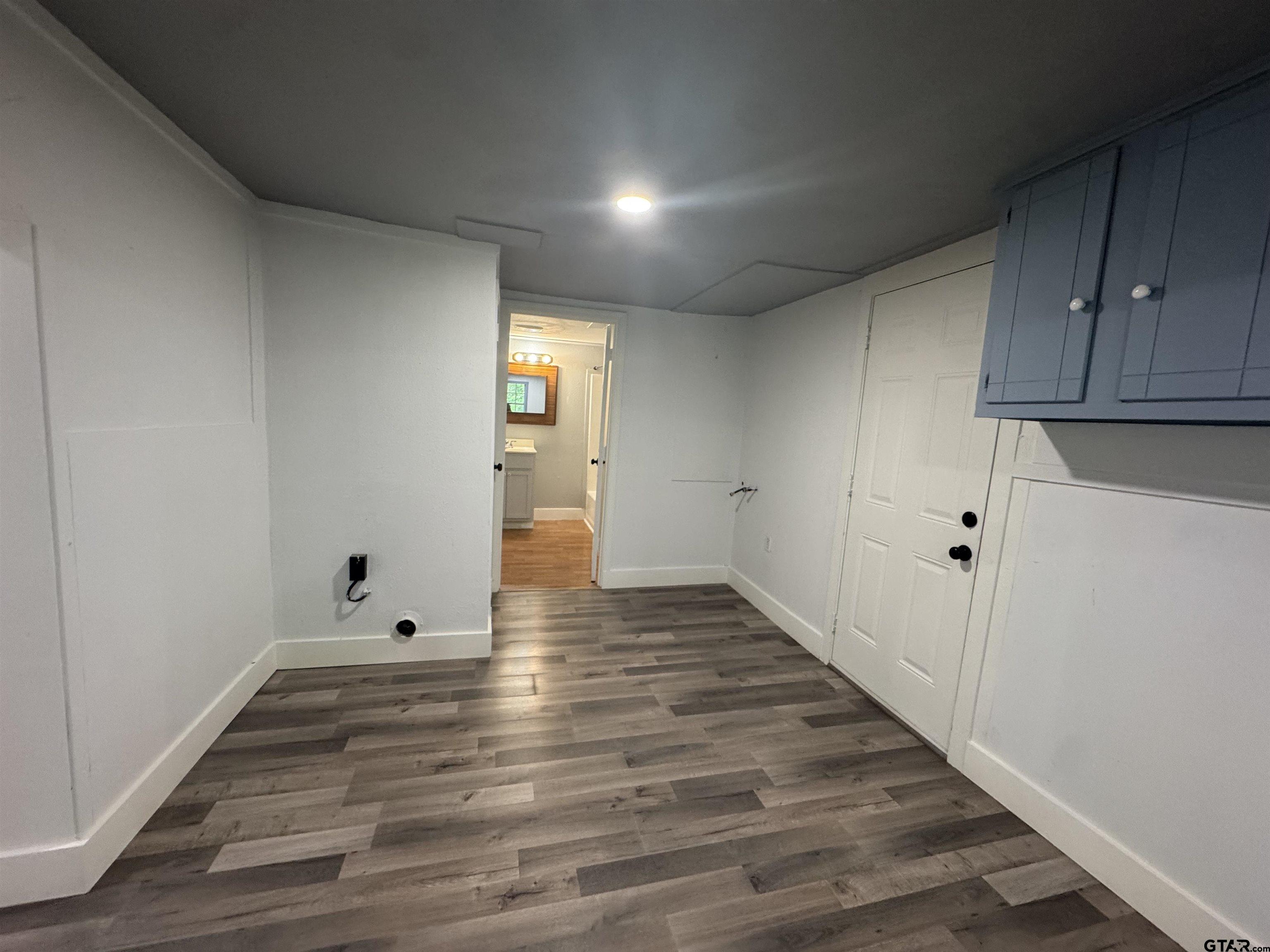 8124 County Road 381 Tyler, TX 75708 - Photo 18 of 23 a view of an empty room with wooden floor