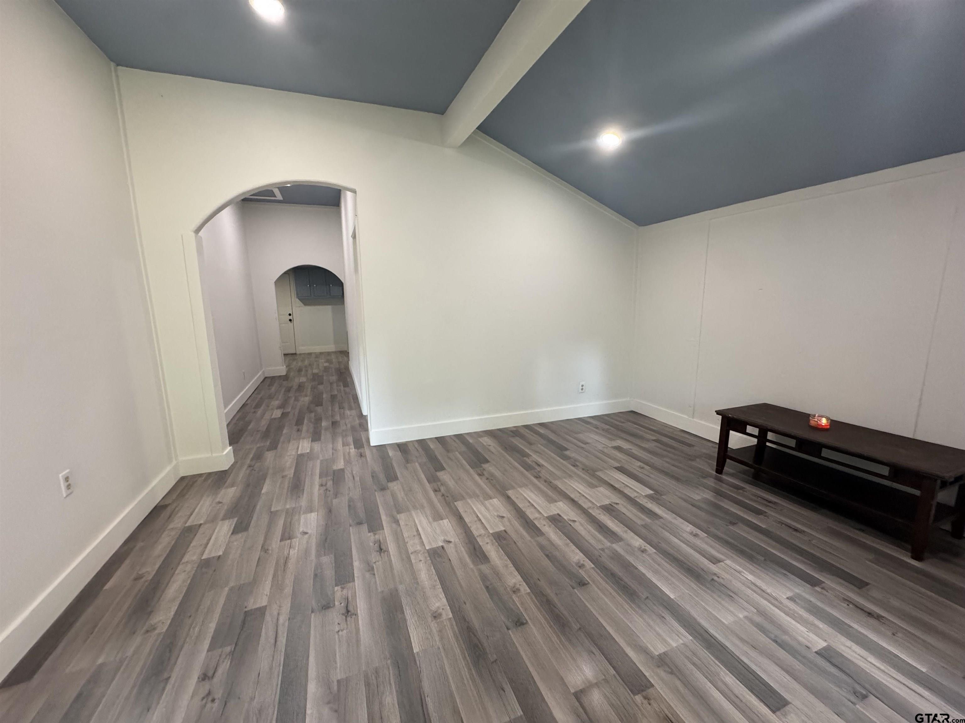 8124 County Road 381 Tyler, TX 75708 - Photo 4 of 23 an empty room with wooden floor and a window