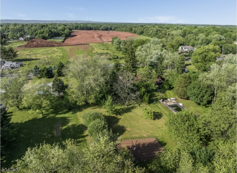 1868 Amwell Road Somerset, NJ 08873 - Photo 21 of 23 a view of a garden with a lake