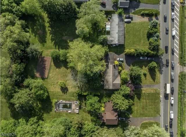 an aerial view of a house with outdoor space