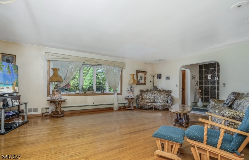 1868 Amwell Road Somerset, NJ 08873 - Photo 5 of 23 a living room with furniture and a large window
