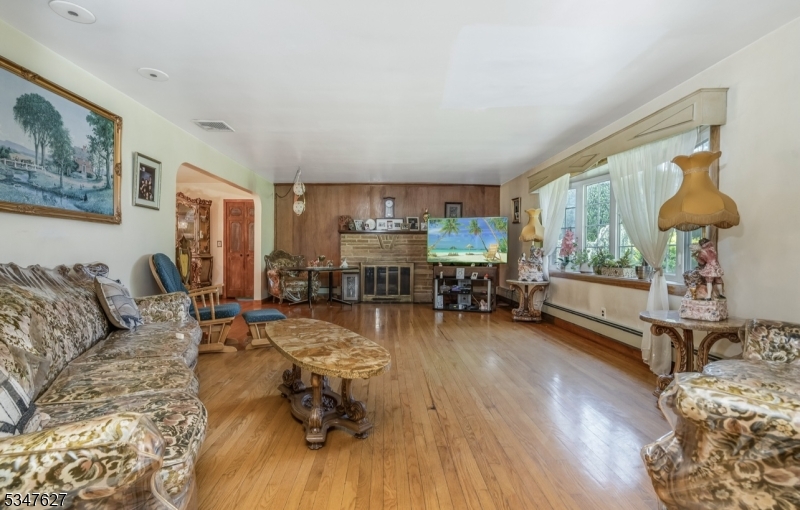 1868 Amwell Road Somerset, NJ 08873 - Photo 6 of 23 a living room with furniture and a wooden floor