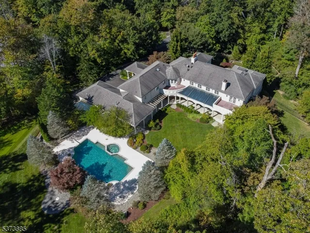 an aerial view of a house with a garden