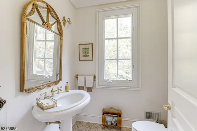 a living room with furniture fireplace and flat screen tv