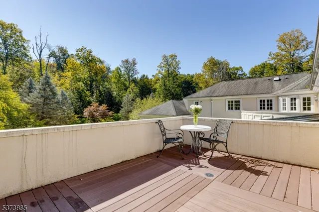 a view of backyard of house with green space