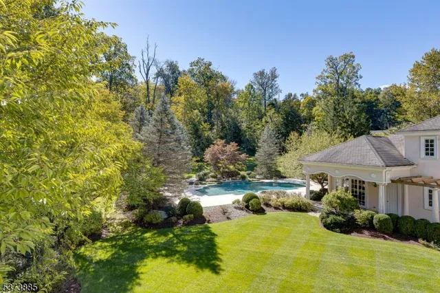 a bathroom with a sink a large mirror and a shower