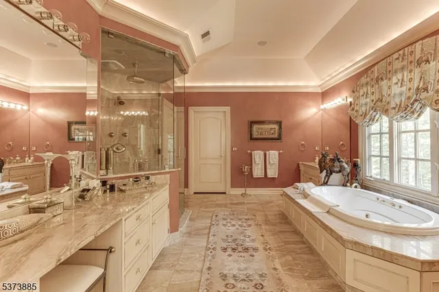 a bathroom with a tub shower and sink