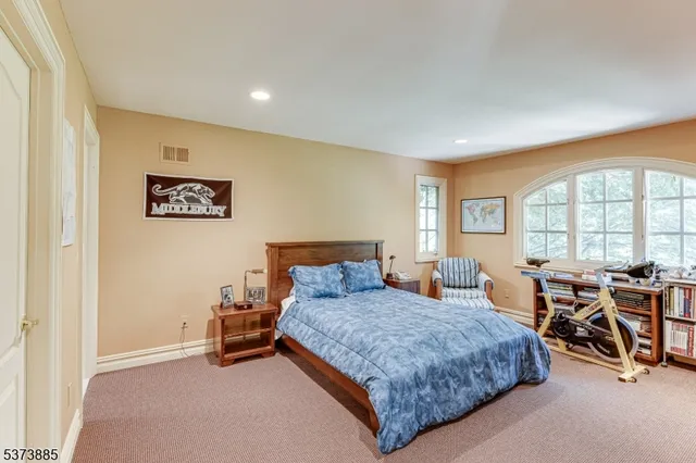 a view of bathroom with a sink mirror and a shower