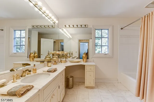 a living room with a bed furniture and a window