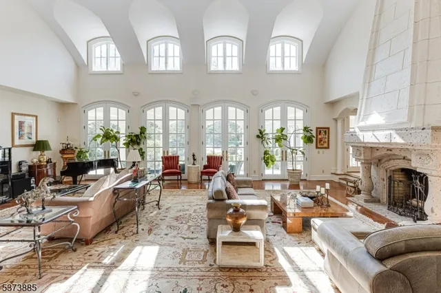 a living room with furniture and a rug