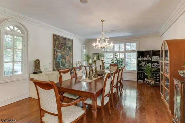 a living room with furniture a dining table and chairs