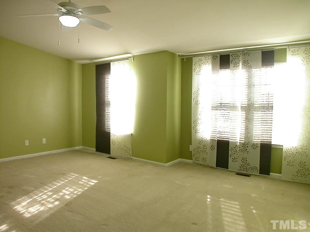 11710 Coppergate Drive, Unit 104 Raleigh, NC 27614 - Photo 12 of 14 a view of an empty room with a window
