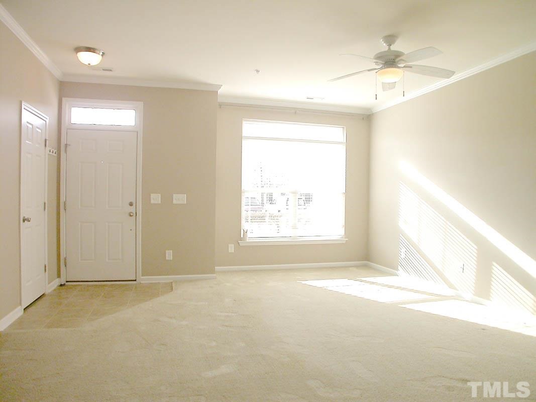 11710 Coppergate Drive, Unit 104 Raleigh, NC 27614 - Photo 3 of 14 a view of an empty room and a window