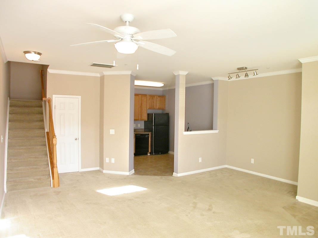 11710 Coppergate Drive, Unit 104 Raleigh, NC 27614 - Photo 4 of 14 a view of a room with a ceiling fan