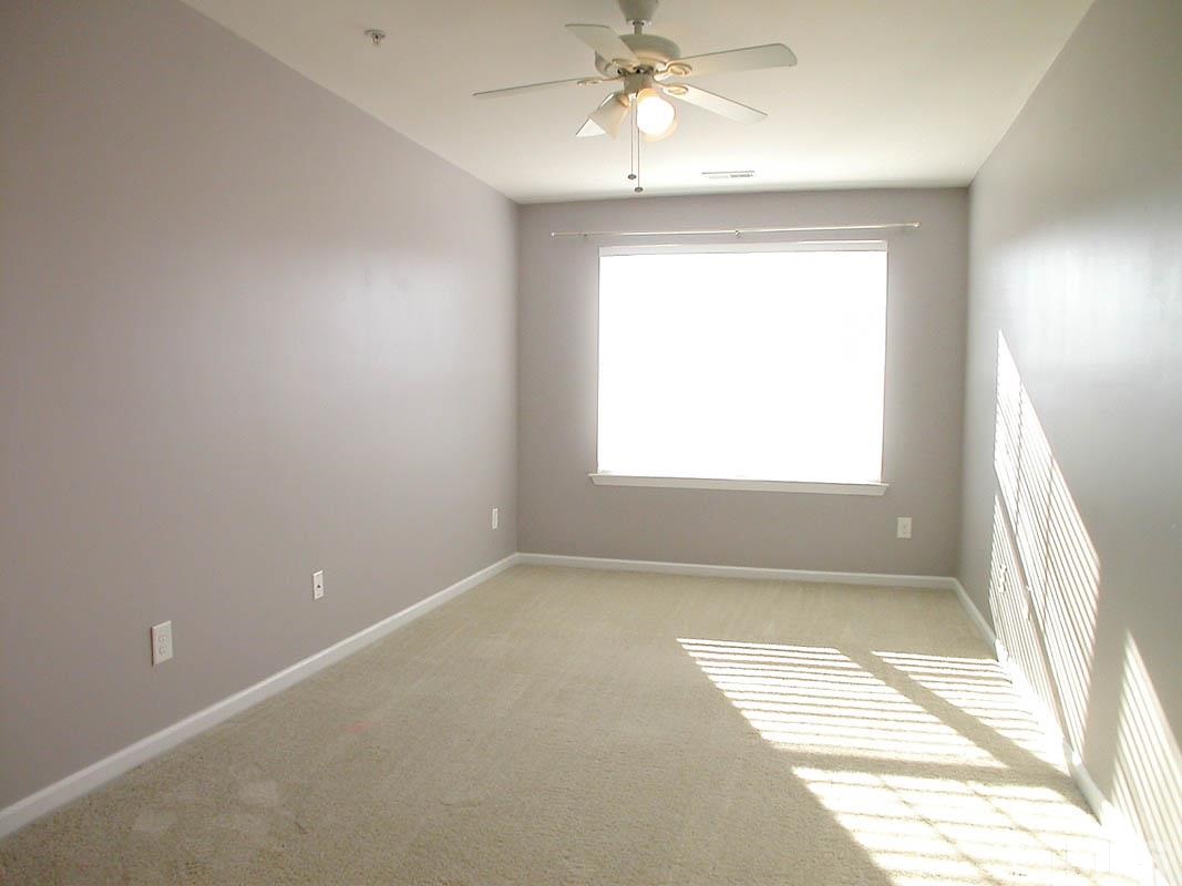 11710 Coppergate Drive, Unit 104 Raleigh, NC 27614 - Photo 8 of 14 a view of an empty room with a window