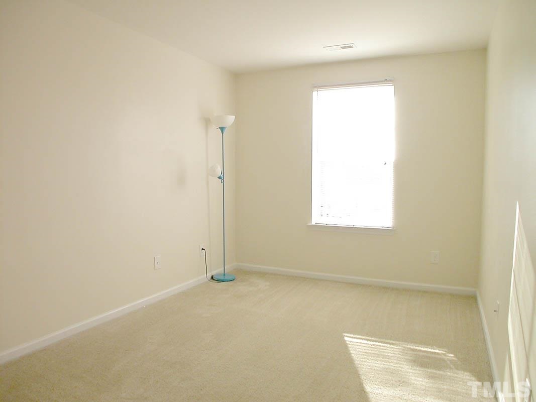 11710 Coppergate Drive, Unit 104 Raleigh, NC 27614 - Photo 9 of 14 an empty room with a window