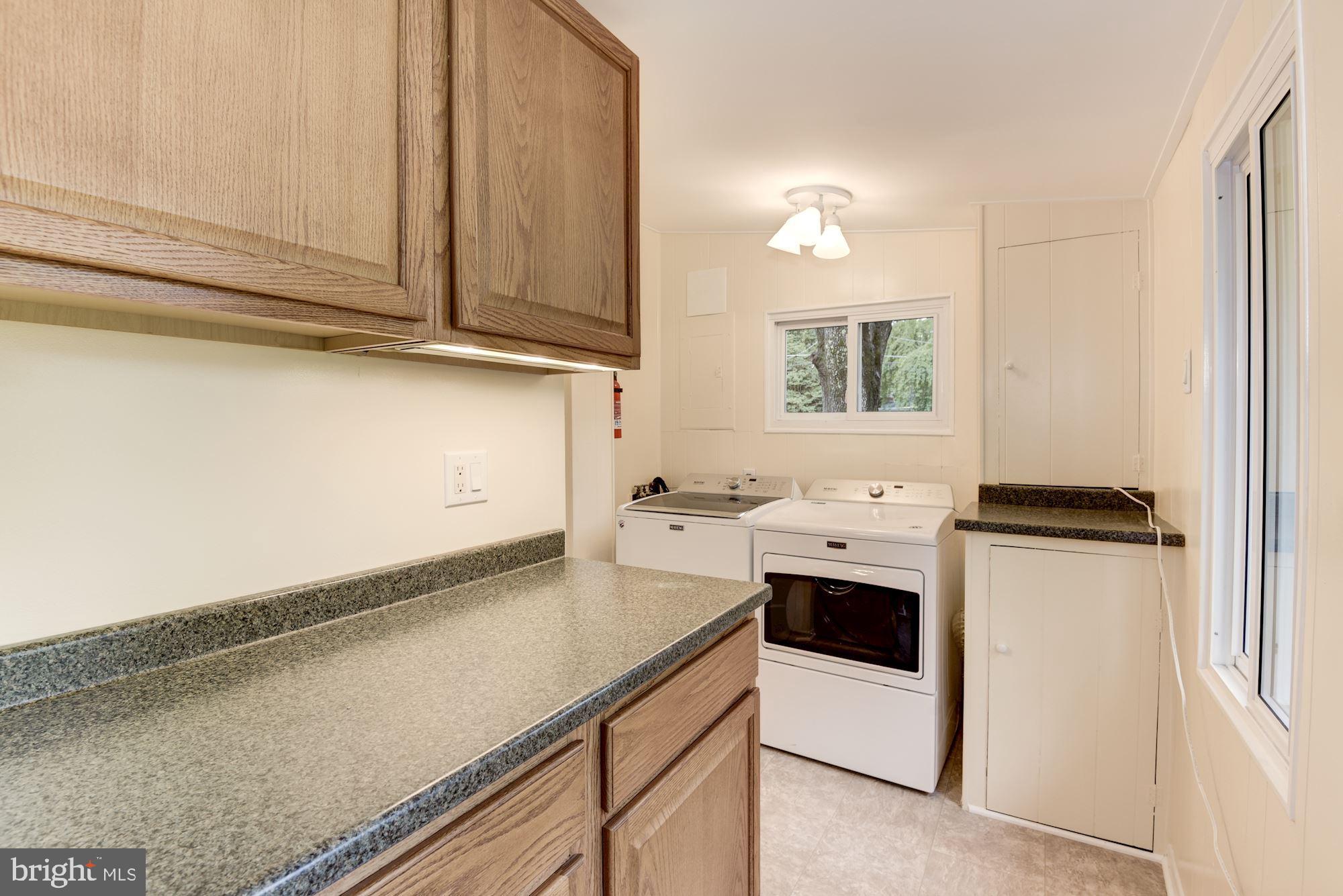 8006 New Market Road Alexandria, VA 22308 - Photo 19 of 37 Cabinets and Counter Space in the Laundry Room